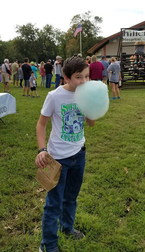 boy eating cotton candy