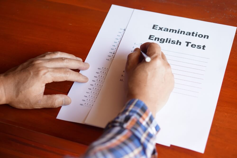 Concept,:,Education,Evaluation.,Student's,Hand,Is,Writing,Answer,On