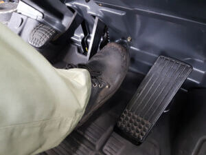 Foot,Pressing,The,Brake,Pedal,Of,A,Forklift