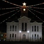 lampasas county courthouse with christmas lights above building and large star at top