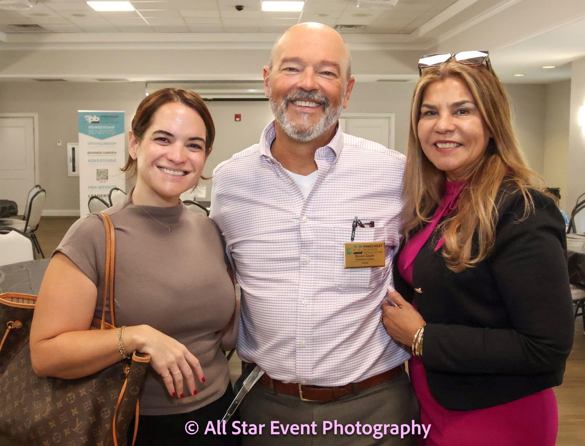 Three attendees enjoying a PBA networking event