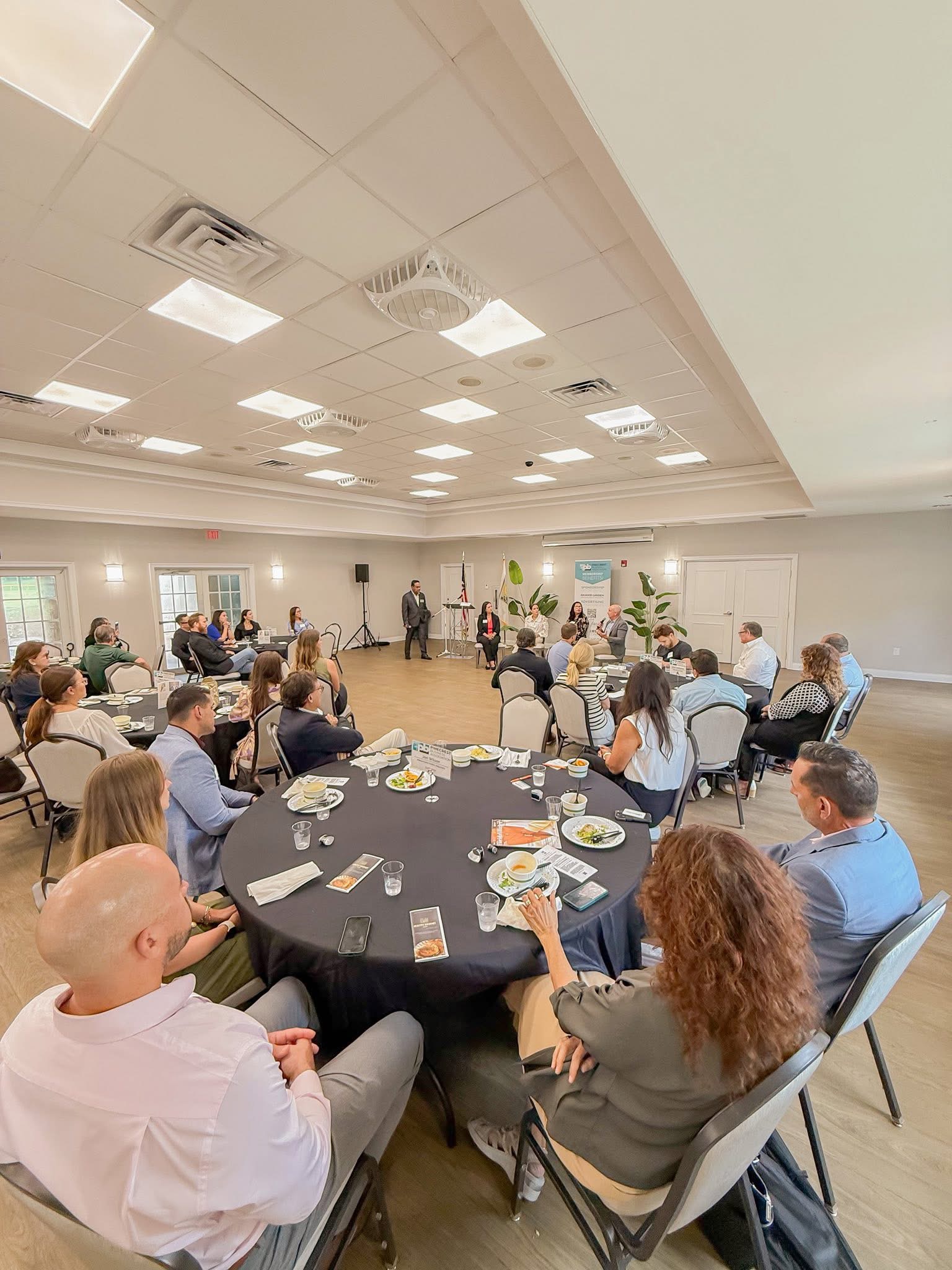 Attendees gathering around tables at a PBA luncheon