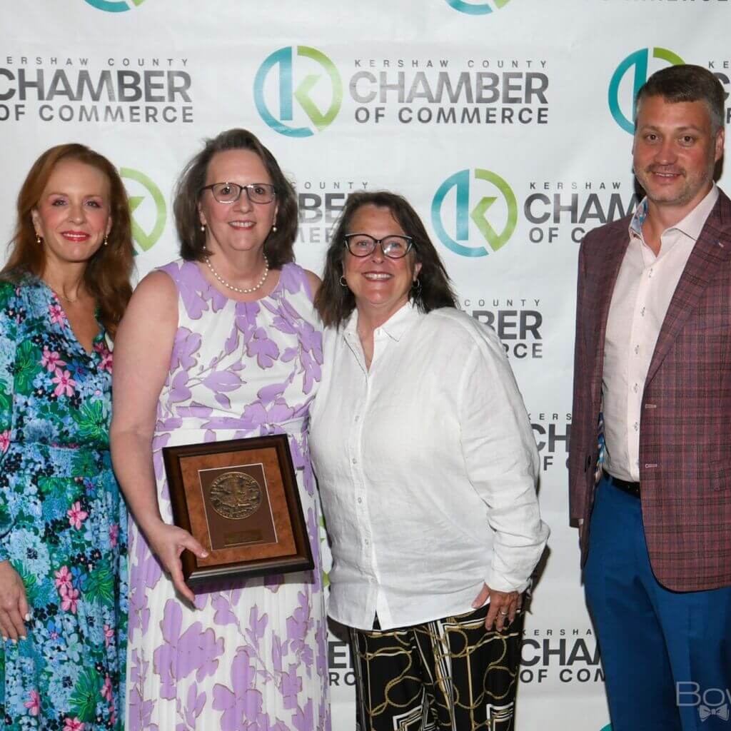 Bobby T Bobby T. Jones Humanitarian Award winner, Dr. Tallulah Fellers Holmstrom with Chamber Board Chair, Stacy Collier (L), Susan Jones (Bobby's daughter) and representing award sponsor, AllStaff Employment, Grady Catoe (far right)