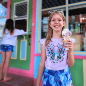 girl smiling holding ice cream cone