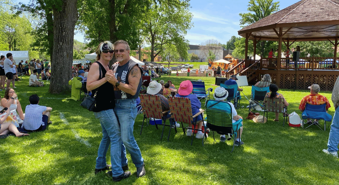 A couple dances to live music in Sylvan Park in Lanesboro during the annual Rhubarb Festival.