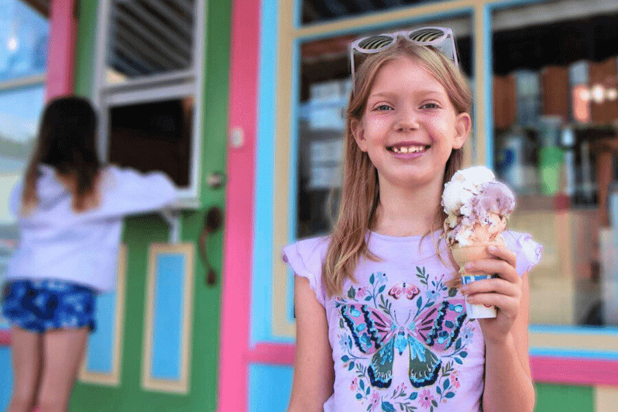 A girl smiling and holding an ice cream cone in Lanesboro, MN