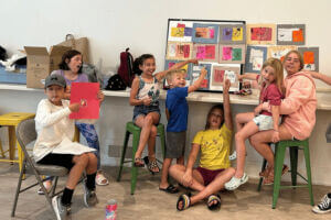 Kids showing off their artwork in Lanesboro, MN