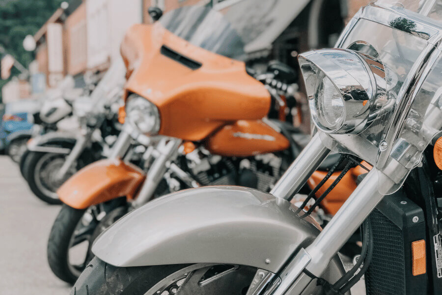 A line of motorcycles parked on main street in Lanesboro, MN