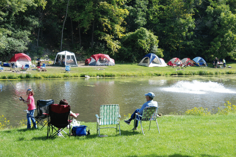 People camping, fishing, and relaxing at Sylvan Park in Lanesboro, MN