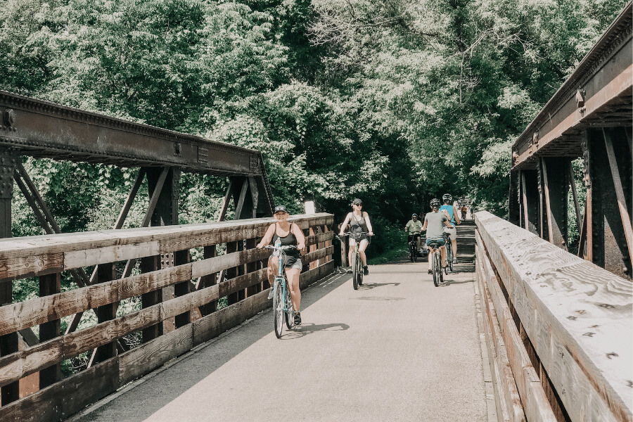 People riding bikes on the Root River State Trail