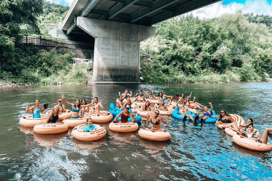 A large group of people tubing on the Root River in Lanesboro, MN