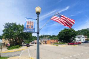 American flag next to a "Historic Lanesboro" sign