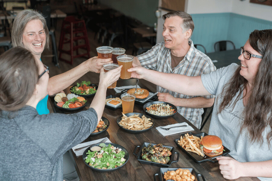 People enjoying a meal and beverages at Pedal Pusher's Cafe in Lanesboro