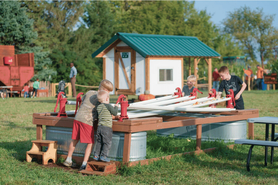 Kids doing the duck races at Big Springs Farm Pupkins & Corn Maze in Lanesboro, MN