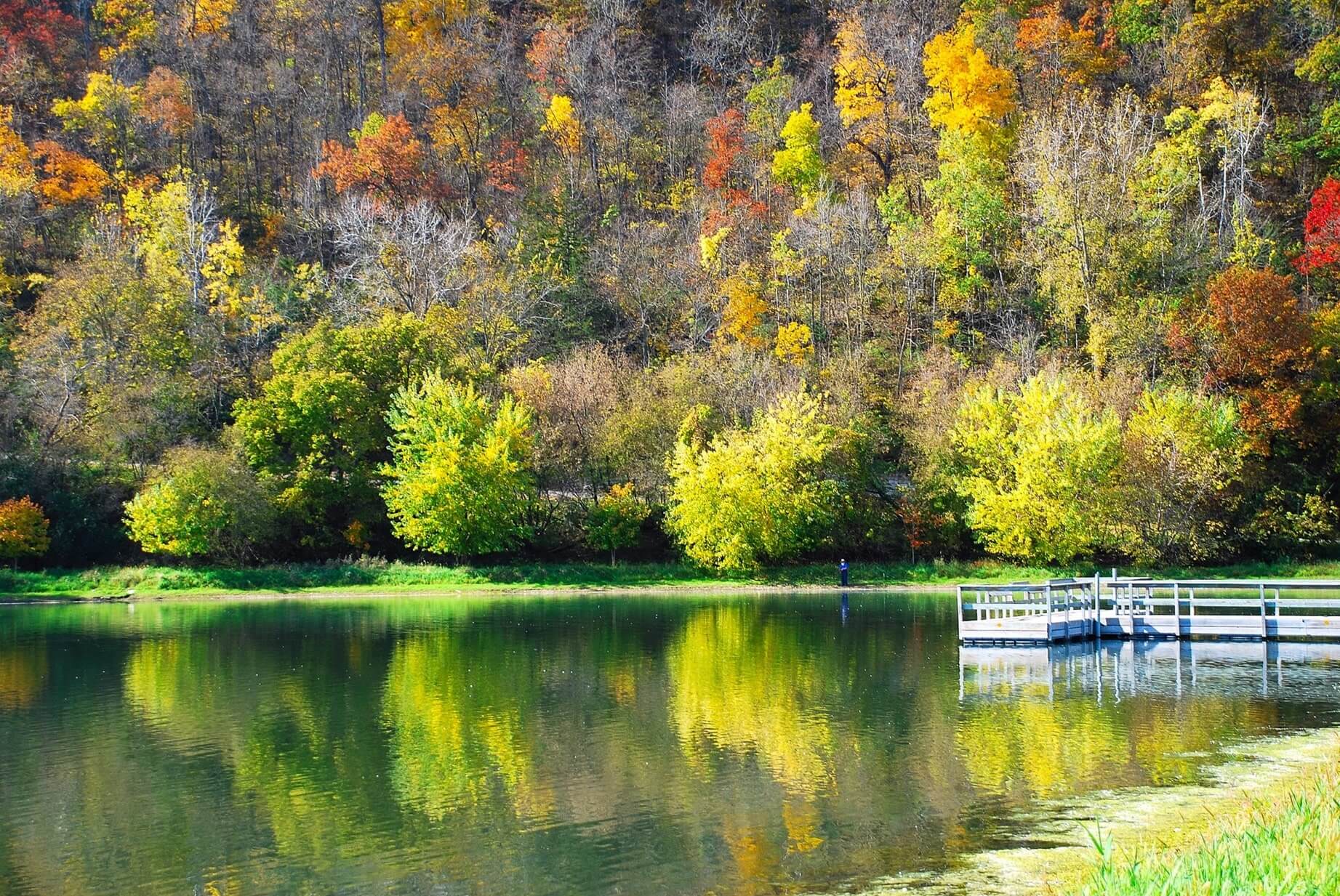 Amish fisherman at the bass pond during fall in Lanesboro, MN
