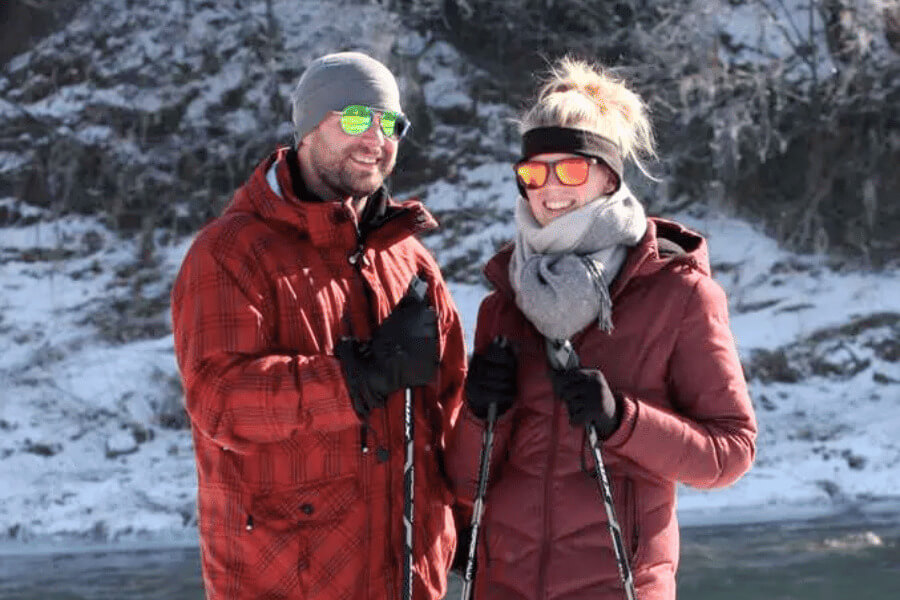 Two people holding ski poles at Cedar Valley Resort