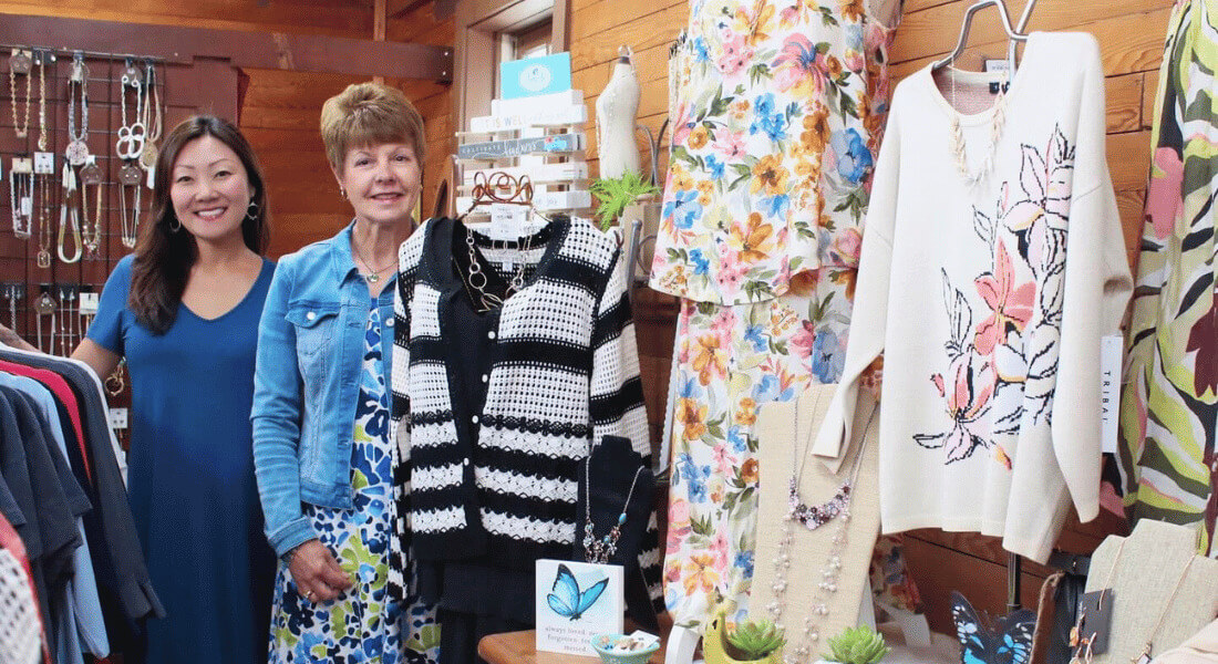Two women standing in Stone Mill Clothing & Gifts in Lanesboro, MN