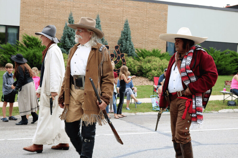 Buffalo Bill and his Wild West crew make a grand entrance during the Buffalo Bill Days parade / Photo by Bluff Country Photography