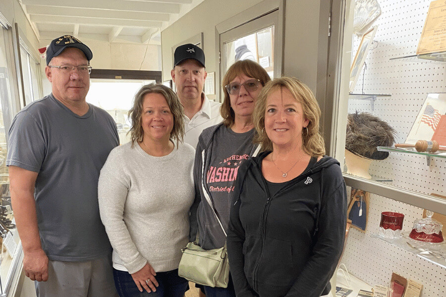 A group of five people inside the Lanesboro History Museum