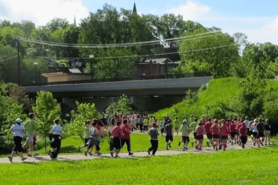 People running as part of the Rhubarb Fun Run at the Rhubarb Festival in Lanesboro, MN