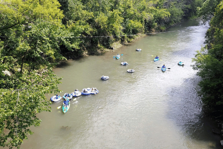 People tubing and kayaking on the Root River in Lanesboro, MN