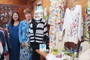 Two women standing in Stone Mill Clothing & Gifts in Lanesboro, MN