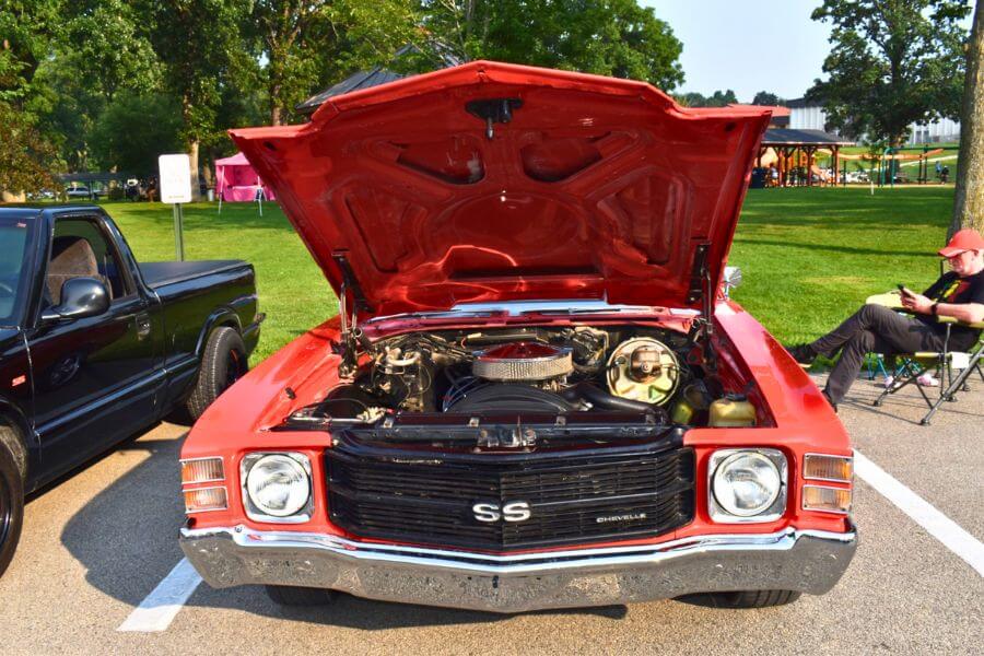 Front view of a red Chevrolet Chevelle SS with its hood open, showcasing the engine at the Buffalo Bill Days classic car show in Lanesboro, Minnesota.