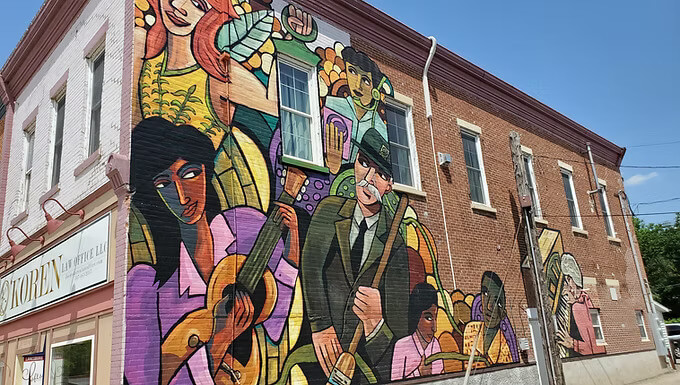 Historic mural in downtown Lanesboro, Minnesota, depicting scenes from the town’s past and celebrating its heritage.