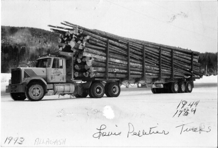 Louis Pelletier logging truck loaded with timber in Allagash Maine 1992 handwritten label by Vernon Pelletier from family archive