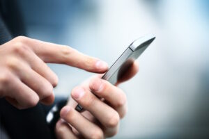 Close up of a man using mobile smart phone Cell phone