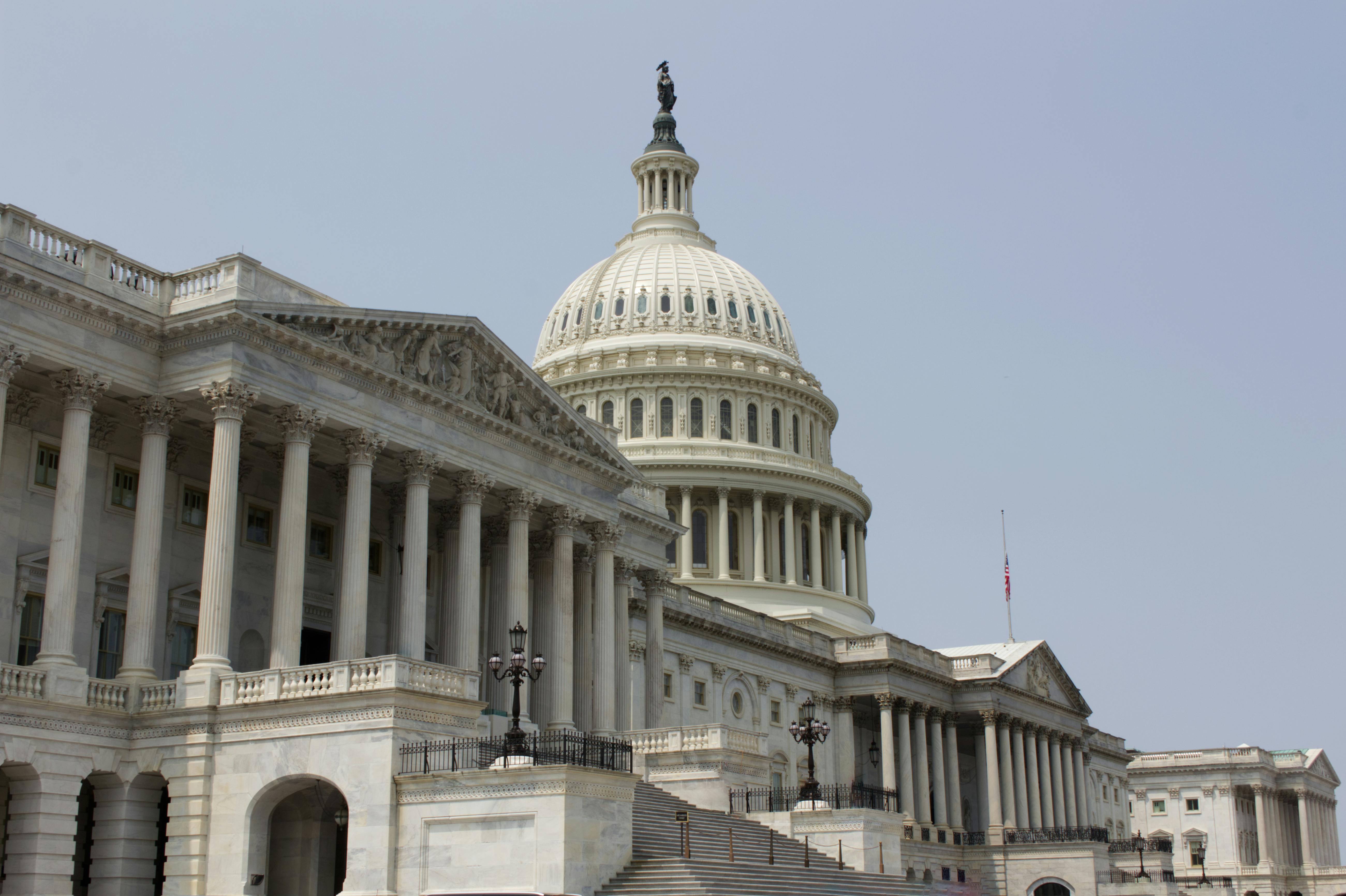 U.S. Capitol Building against a pale blue sky