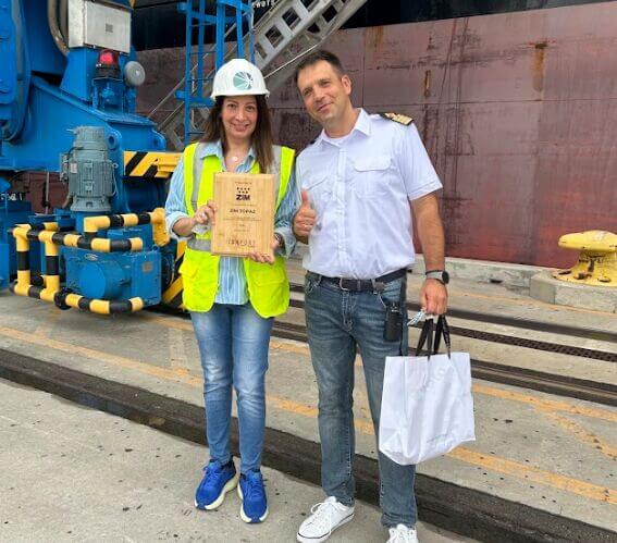 JAXPORT Director of Ocean Carrier Development Joyssy Woody presents a maiden voyage plaque to the captain of the ZIM vessel Topaz.