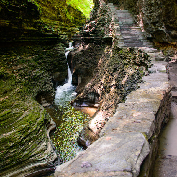 Natural rock walking Gorge Trail with waterfalls in Watkins Glen State Park