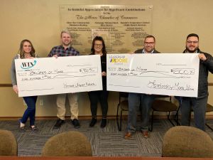 The Moore Chamber of Commerce Women’s Impact Network and Leadership Moore Alumni together donated $1,700 to their 2022 community partner Bridges of Moore. Pictured from left are Katelyn Dockery, Zach Smith, Catherine Landros, Mike Smith and Gareth Williams.