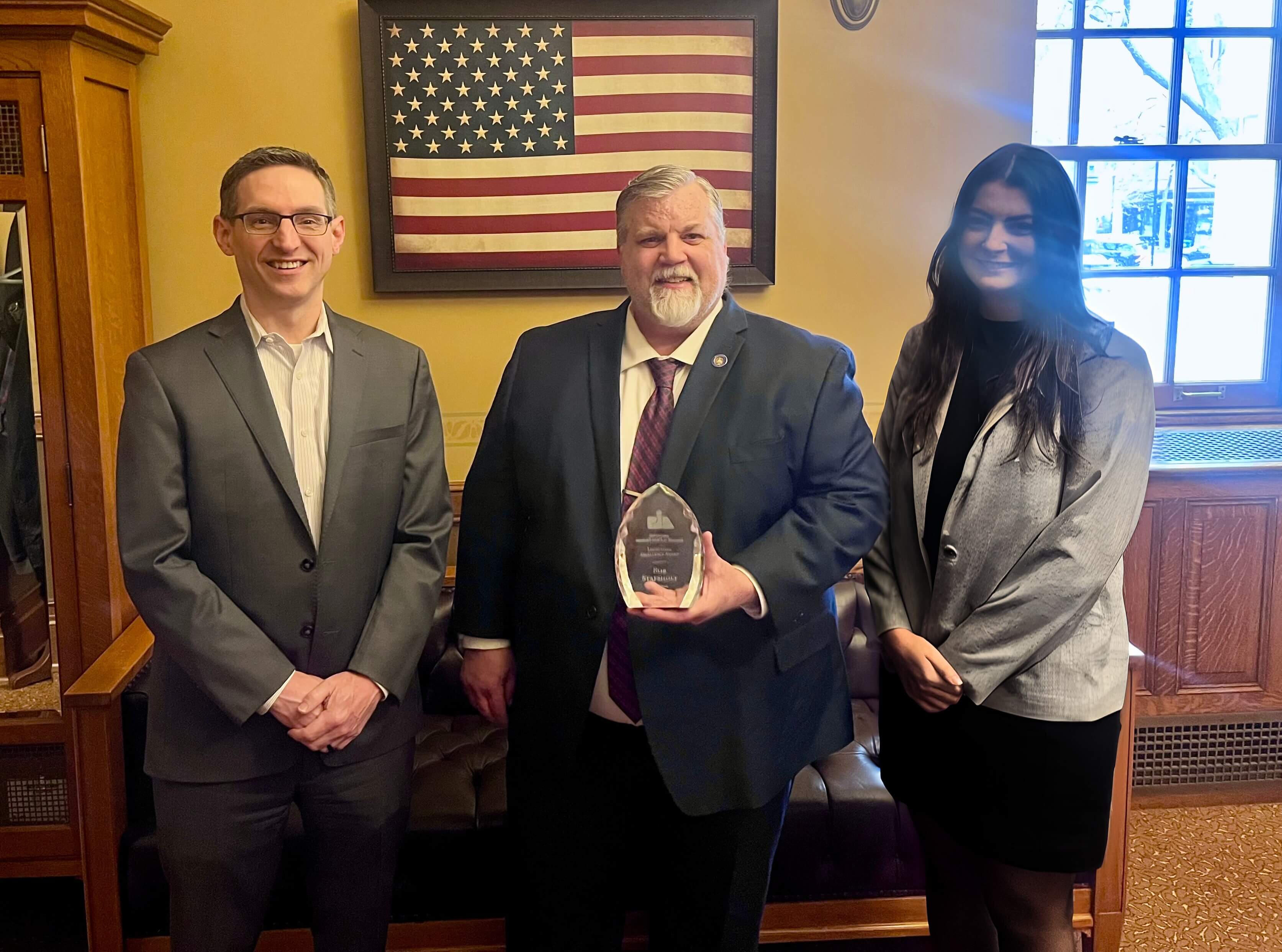 Sen. Stafsholt Award Sen. Stafsholt receives his award from PIA Executive Director Pete Hanson and Natalie White