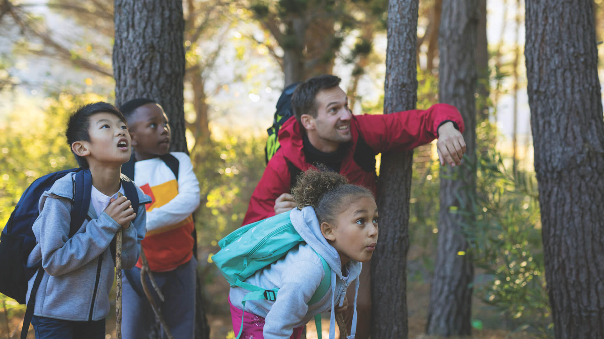 Children exploring the nature with supervisor