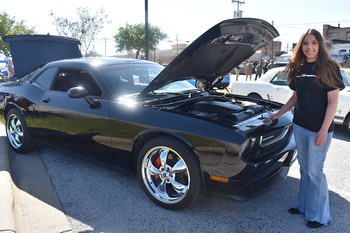 Cars Coffee-attendee showing off her car