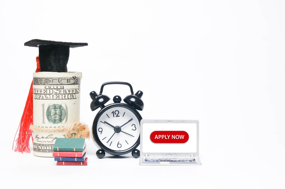 A,Picture,Of,Fake,Money,Wearing,Mortarboard,,Miniature,Of,Book,