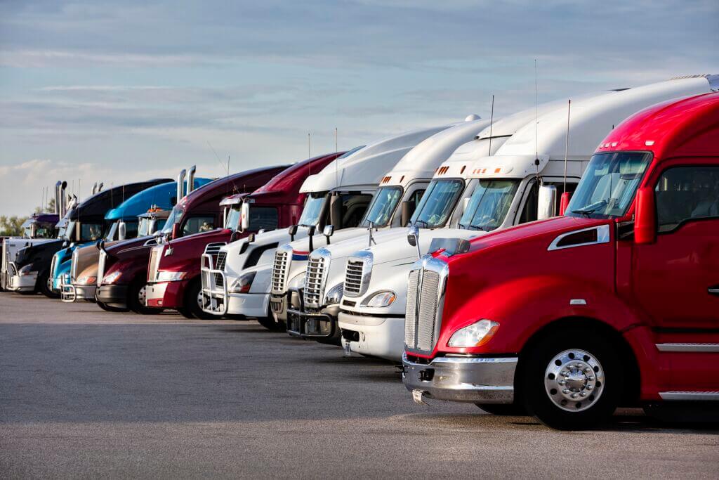 Group of semi trucks parked at truck stop, American transport concept, Missouri, United States.