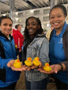 holding rubber ducks
