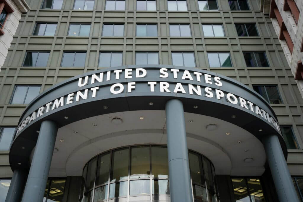 Washington, DC, USA - June 22, 2022: Front view of the United States Department of Transportation (DOT) headquarters in the Southeast Federal Center in Washington, DC. Washington, DC, USA - June 22, 2022: Front view of the United States Department of Transportation (DOT) headquarters in the Southeast Federal Center in Washington, DC.