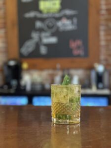 a whiskey glass on a bar