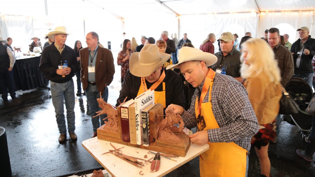 Local Sculptors Work on a Pair of Clay Bookends During the Buffalo Bill Art Show & Sale Quick Draw Event