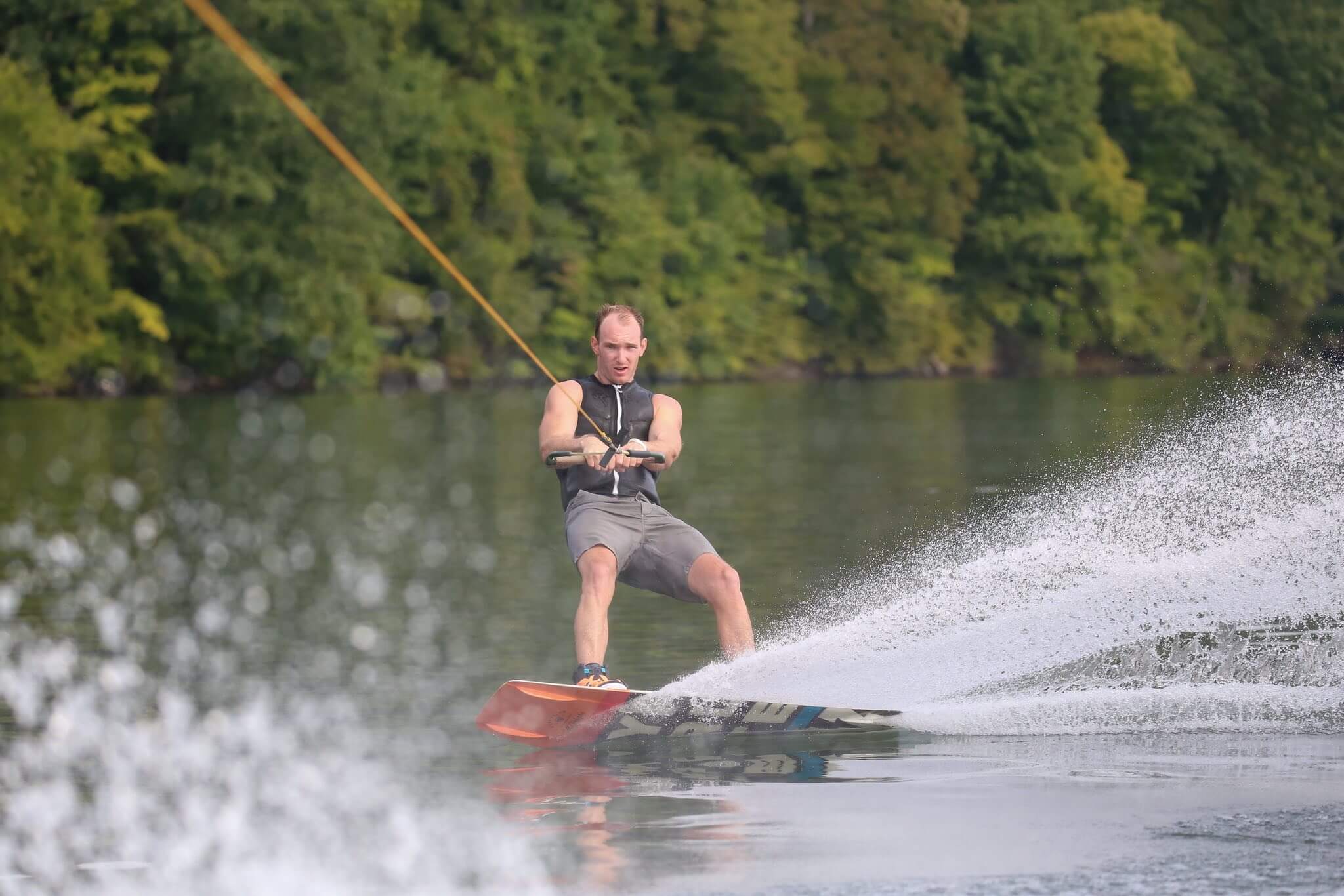 A photo of a Tullahoma, Tennessee visitor wakeboarding on Tims Ford Lake.