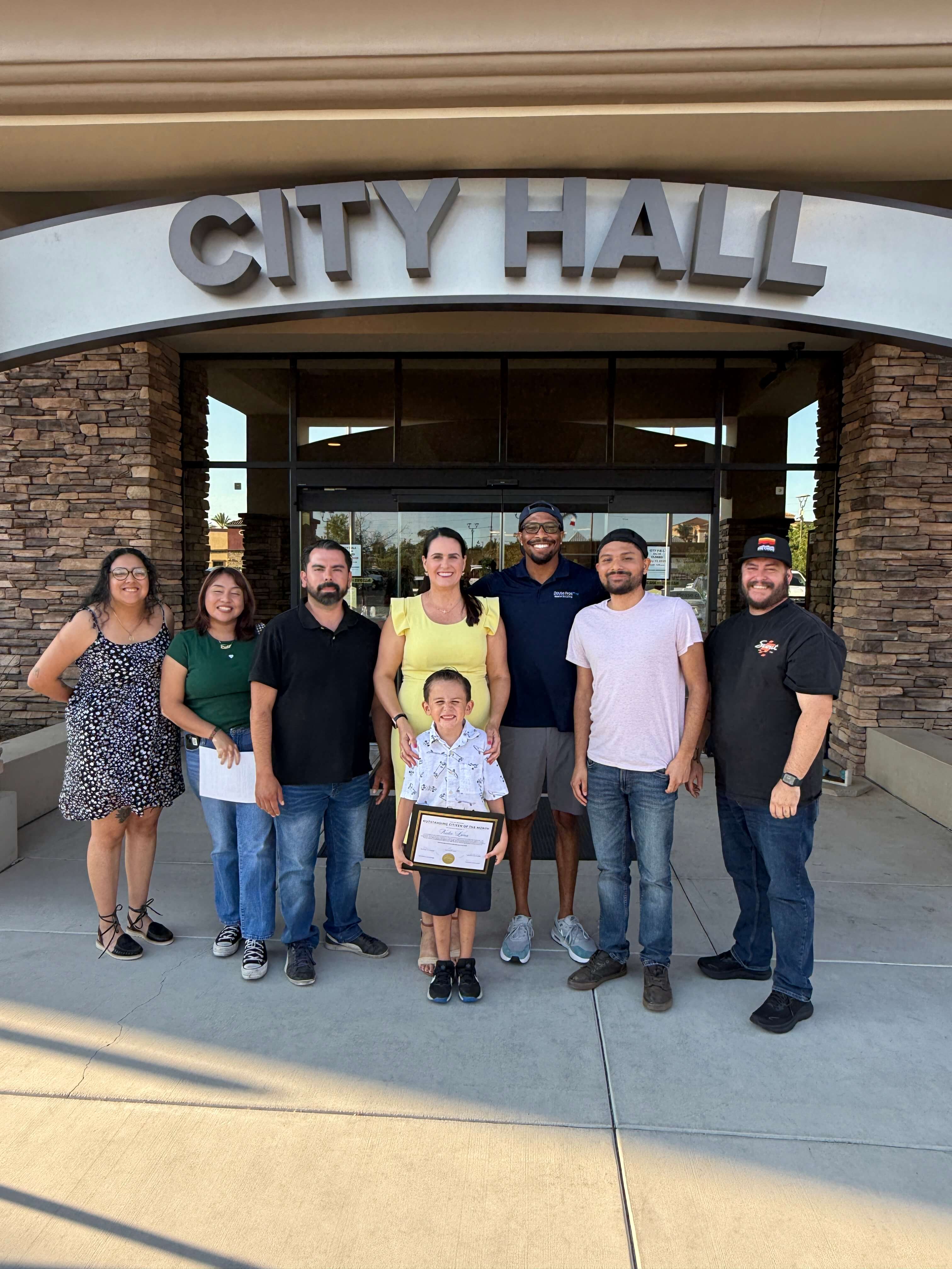 Chamber board and staff take a picture outside of City Hall with Katie Luna, Citizen of the Month