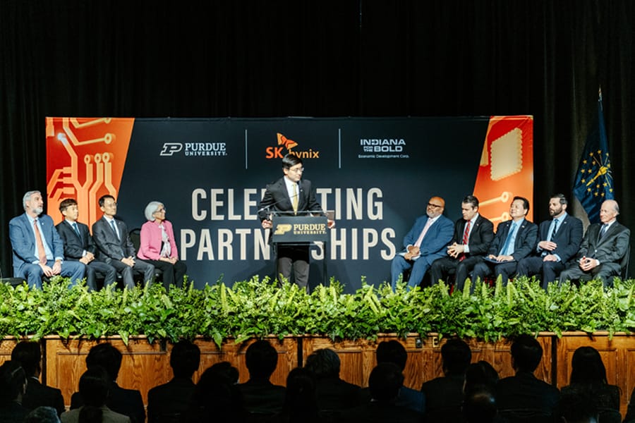 SK hynix announced Wednesday (April 3) semiconductor advanced packaging investment in Purdue Research Park. From left to right: Mung Chiang, Purdue University president;  Indiana Gov. Eric Holcomb; Kwak Noh-jung, SK hynix president and CEO; Woojin Choi, SK hynix executive vice president; Arati Prabhakar, director, White House Office of Science and Technology Policy, and assistant to the president for science and technology; U.S. Sen. Todd Young; Arun Venkataraman, U.S. Department of Commerce assistant secretary; Hyundong Cho, ambassador of the Republic of Korea to the United States; David Rosenberg, Indiana secretary of commerce; Mitch Daniels, Purdue Research Foundation chairman. (Purdue Research Foundation/Charles Jischke)