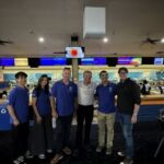 Lead Dublin Cohort Standing in front of bowling lanes