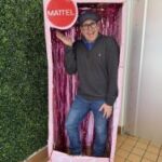 Lead member posing in a life-sized barbie box