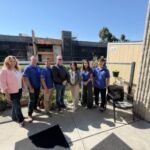 Lead cohort posing on a patio outside of Mission Hope Day Program