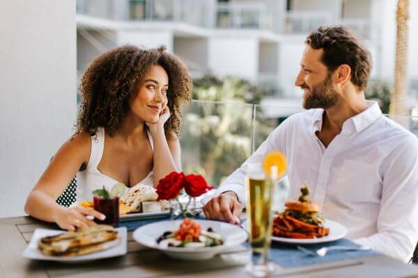 Photo of a couple dining at Zota Beach Resort